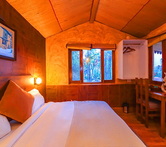 Jungle Babbler Mud House at Mukteshwar Oakwood Resort
